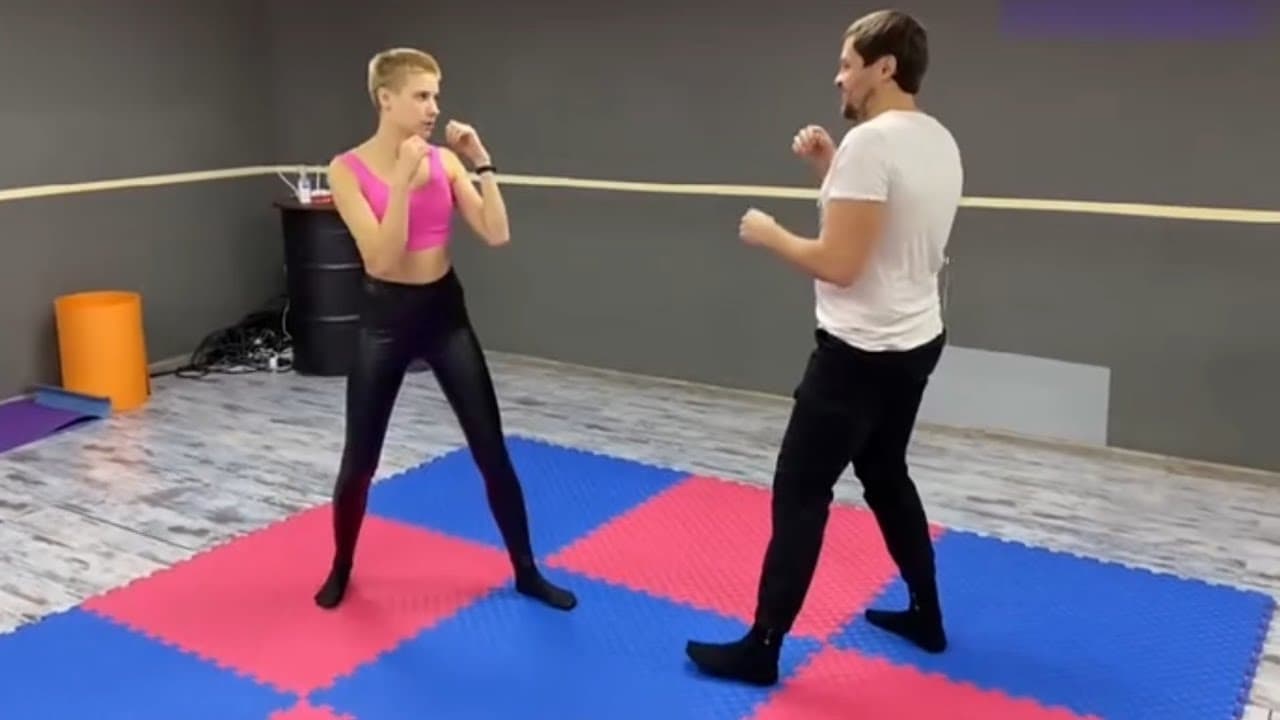 Self-Defense Practice in the Gym Learning Boxing Moves with a Trainer