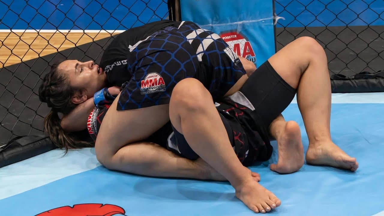 Women mma fight with dominant position